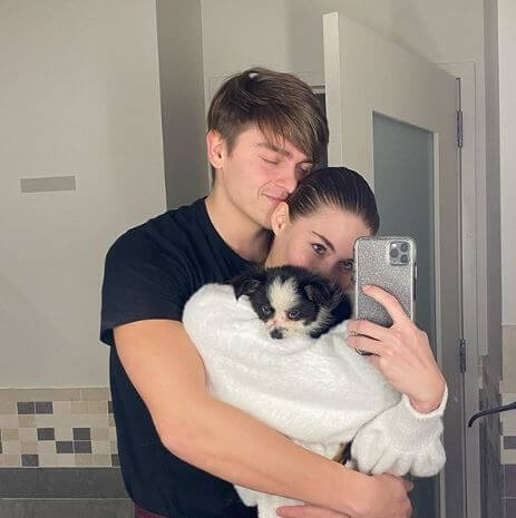 Arnold Cabe's daughter, Grace Elizabeth with her fiancé and dog.